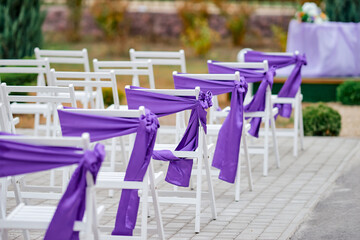 white chairs decorative for holiday wedding