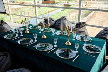 table setting decorated tableware with gold rim candlesticks