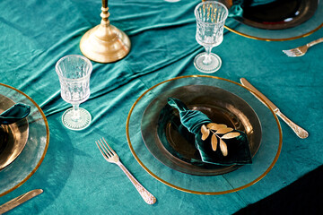 table setting decorated tableware with gold rim candlesticks