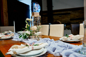 napkins on the table with a seating card restaurant wedding decor