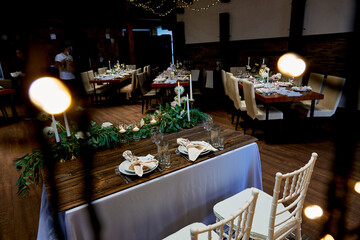 table for the bride and groom decorated with live floristry