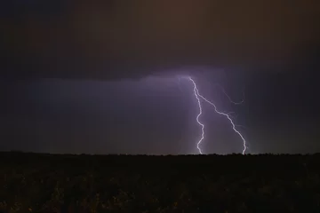 Fotobehang double lightning in the night sky bright flash © Oleg Kyslyi