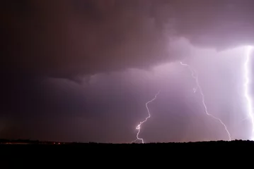 Fotobehang double lightning in the night sky bright flash © Oleg Kyslyi