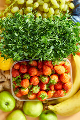 Flat lay of ripe organic healthy food Fruits, microgreens, vegetables on orange background, copy space for text, top view, market local farm concept, harvest, food delivary, diet, vegan concept.
