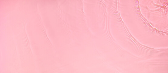 Abstract summer banner background Transparent pink clear water surface texture with ripples,...