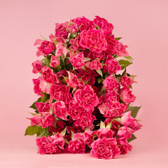 Fresh pink roses as arch on abstract pink scene mockup for presentation cosmetic products or goods,...