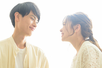 Portrait of a couple staring at each other in backlight