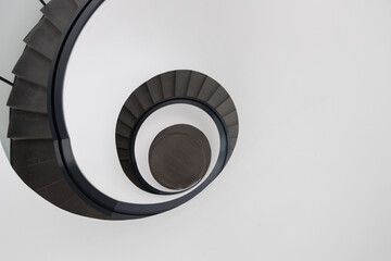 Fototapeta premium Сircular staircase. Part of a modern minimalist staircase in circular form in white background