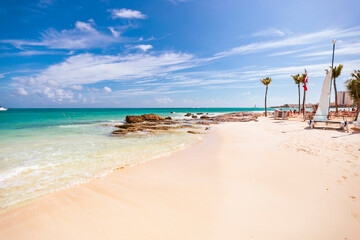 Obraz na płótnie Canvas Cancun Mexico beautiful caribbean sea on a sunny day and cloudy sky. sandy beach