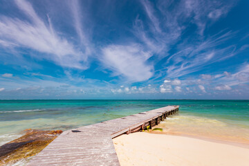 Cancun Mexico beautiful caribbean sea on a sunny day and cloudy sky. Sandy beach