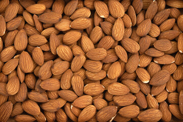 background of peeled almond nuts, close up