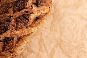 fresh homemade bread on parchment for baking, top view