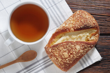 Tea and bun with cottage cheese