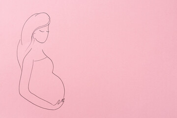 Pregnant woman figure drawn on pink background, top view with space for text. Surrogacy concept