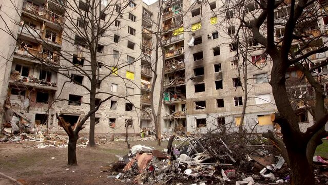 Damaged ruined and burnt out multi-storey house in ukrainian city Chernihiv near Kyiv on north of Ukraine. Ruins during War of Russia against Ukraine. Walls, broken windows of buildings. Aircraft hit