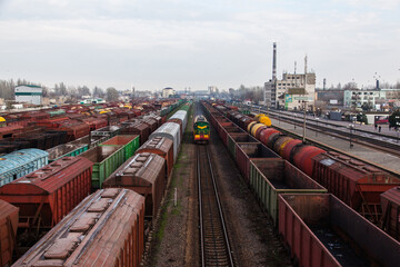 Fototapeta na wymiar Railway tracks, freight and passenger trains at the station.