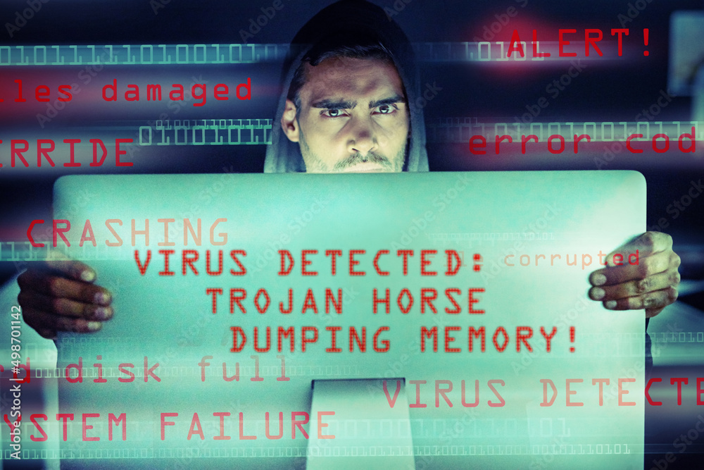 Aufkleber Your computer could become your worst enemy. Portrait of a serious computer hacker using a computer in the dark.