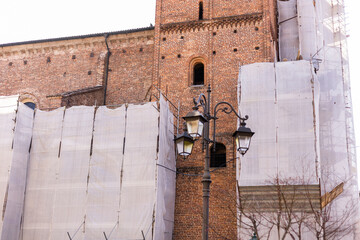 old brick building in italy with scaffolding