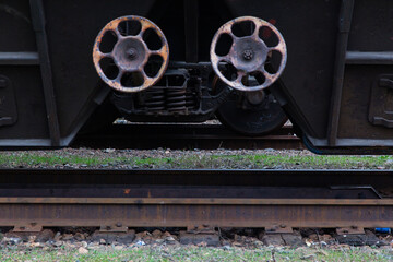 Wheel of a railway train with springs and rails.