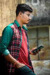 Boy holding mobile,