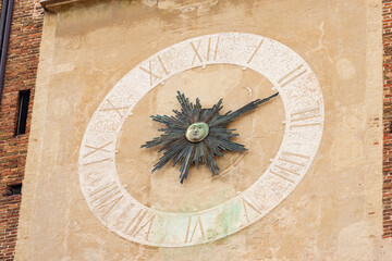 Close-up of the clock face of the bell tower of Treviso Cathedral (Duomo o Cattedrale di San Pietro Apostolo - Saint Peter the Apostle), VI-XIX century, Veneto, Italy, Europe.