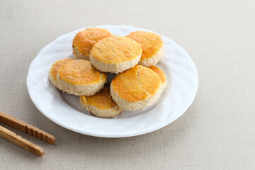 Kue Kacang or Peanut cookies. Homemade cookies for eid mubarak. Served on white plate, space for text.
