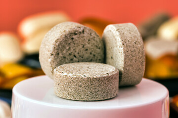 DGL (licorice root extract) chewable tablets. dietary supplement side view. selective focus isometric view dietary concept