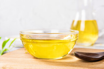 cooking oil in glass bowl on table