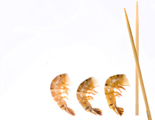 Shrimp and chopsticks on a white background
