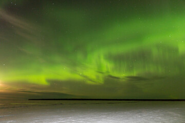 The moonlight mixing with northern lights and clouds
creating a rainbow of colors