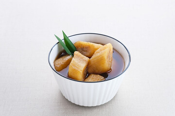 Setup Pisang is traditional dessert made of banana, palm sugar boiled with cinnamon, pandan leaves and cloves. Selective focus image. 
