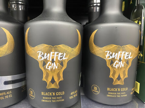 Hasselt, Belgium - April 9. 2022: Closeup of bottles belgian local buffel gin in supermarket shelf