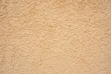 Abstract beige plastered wall background