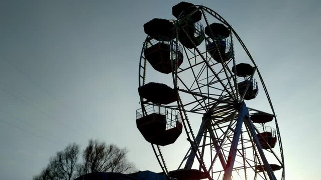 Creepy childhood dream feels rotating ferris wheel silhouette