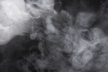 White steam on a black background.