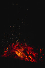 Fototapeta na wymiar Burning coals in the grill, sparks of fire. 