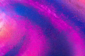 Beautiful bright colorful street art graffiti background. Abstract creative spray drawing fashion colors painting on the walls of the city. Urban Culture, aerosol texture