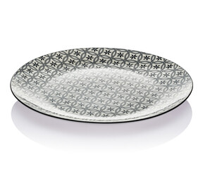 Plate on a white isolated background. Side view, reflection. Small flat round plate.