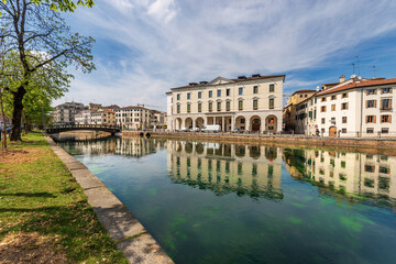 Cityscape of Treviso downtown with the river Sile with the street called Riviera Garibaldi and a...