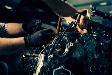 Fototapeta na wymiar Auto mechanic working in garage. Repair service.