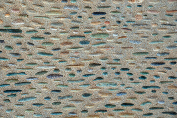 Multicolour pink, olive green, rusty red, gray, yellow ocher, blue natural pebble edges in dusty...