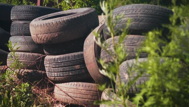Car Tire Rubber Dump. Pile of Old Car Tyres Storage. Stack of Used Tires Junkyard. Heap Black Wheels Ecology Hazard. Environment Disaster Concept