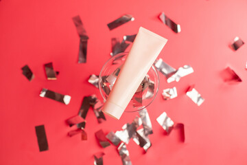 Mockup of beauty cosmetic makeup bottle product with skincare healthcare in glass concept on pink background with celebration confetti.