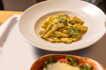 Penne pasta with pesto cream sauce