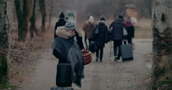 Young Woman With Luggage Looking Back During War.