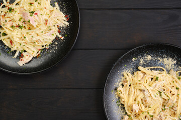 Top view of two plate with pasta