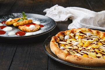 Sweet pie with banana, orange, cranberry and caramel syrup