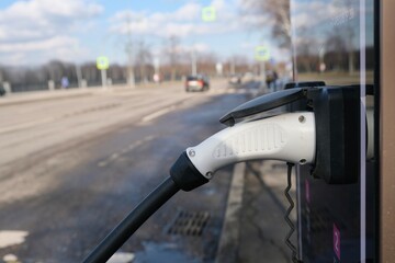 A station for charging the car. The electric car is on charge.