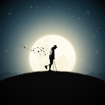 Disabled man on crutches silhouette. Death and afterlife. Full moon