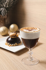 Aromatic coffee drink and delicious chocolate dessert on wooden table